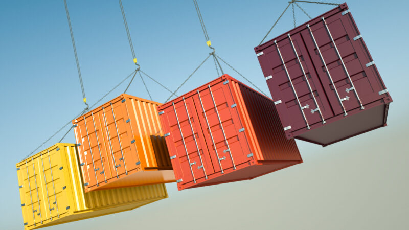 Four Shipping Containers During Transport